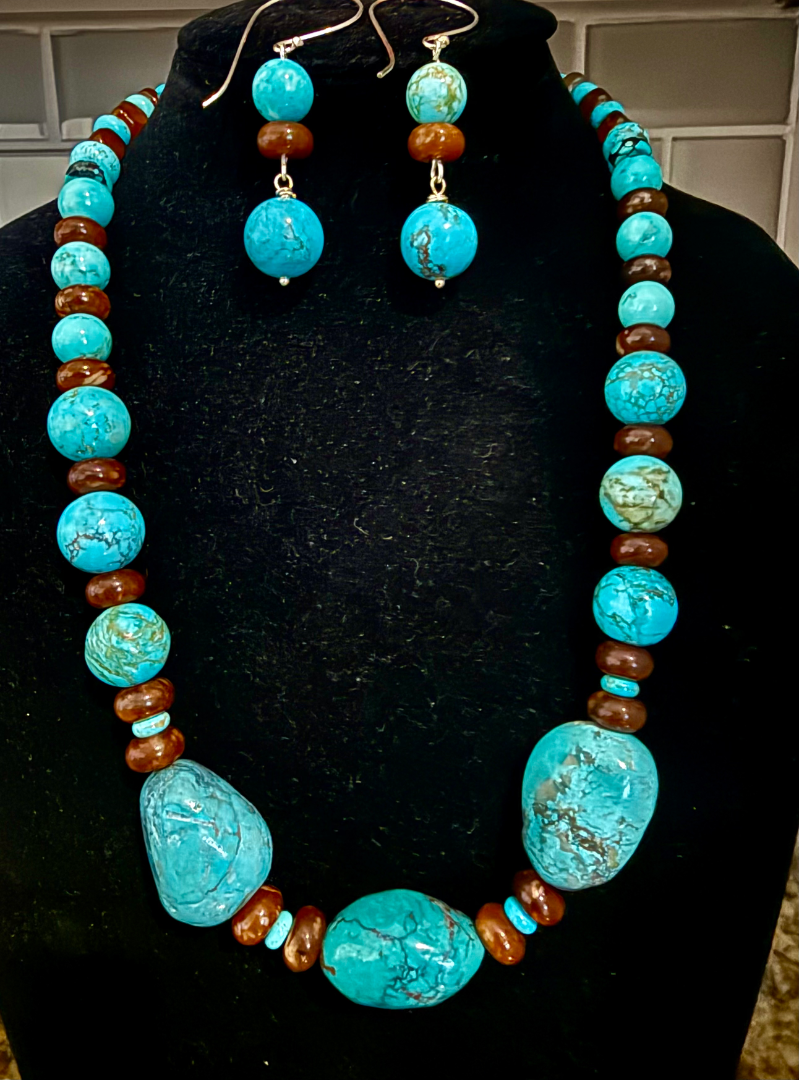 Kingman turquoise set with brown agate accents Image