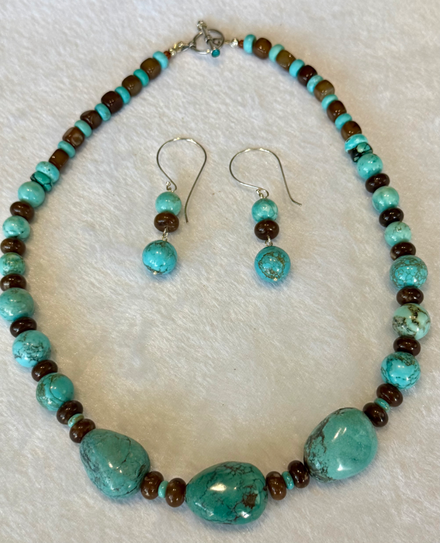 Kingman turquoise set with brown agate accents Image