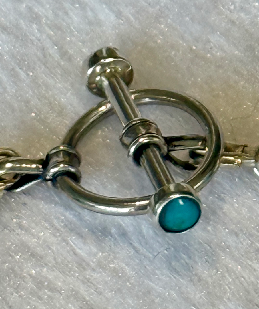 Kingman turquoise set with brown agate accents Image