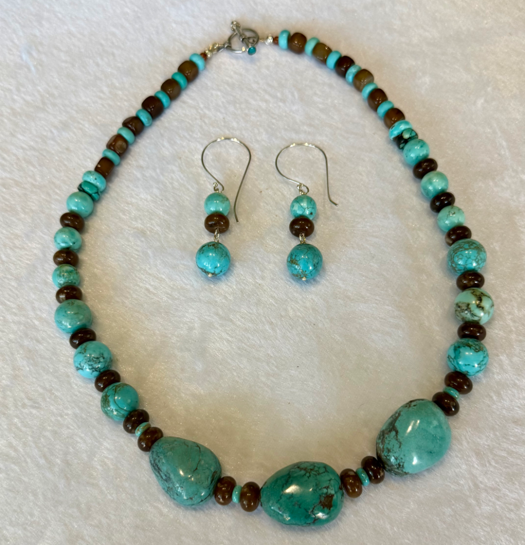 Kingman turquoise set with brown agate accents Image